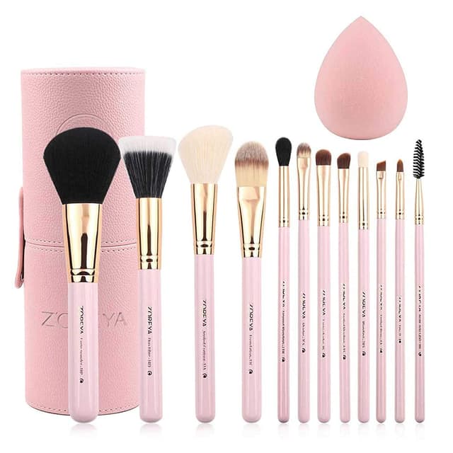 Twelve pink makeup brushes with gold ferrules, a pink organizer case and a matching makeup sponge