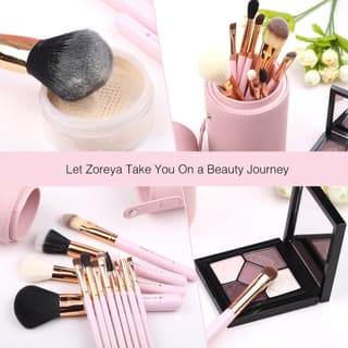 Pink makeup brushes with gold ferrules and a matching organizer case